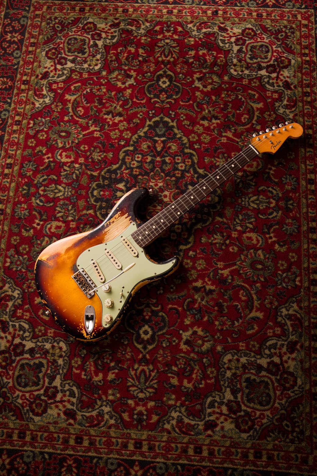 Full Fender Custom Shop John Frusciante Stratocaster on a red oriental rug